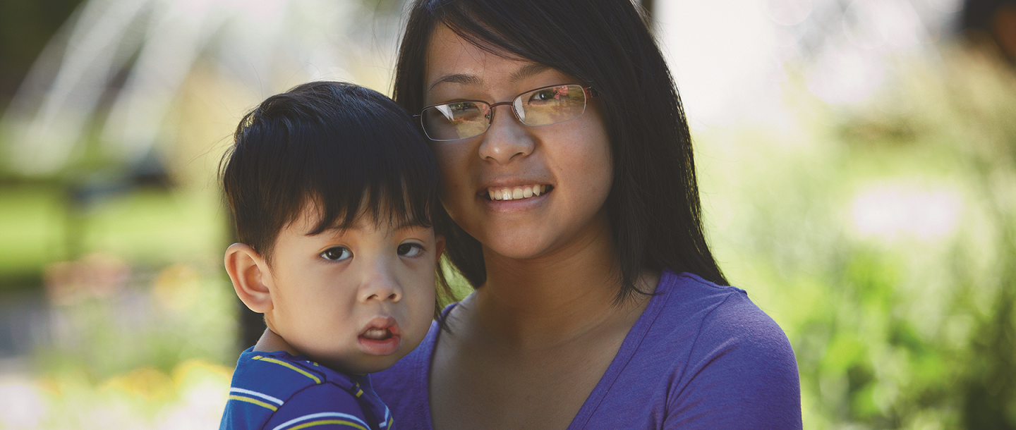 Picture of Asian woman with her child - nontraditional student