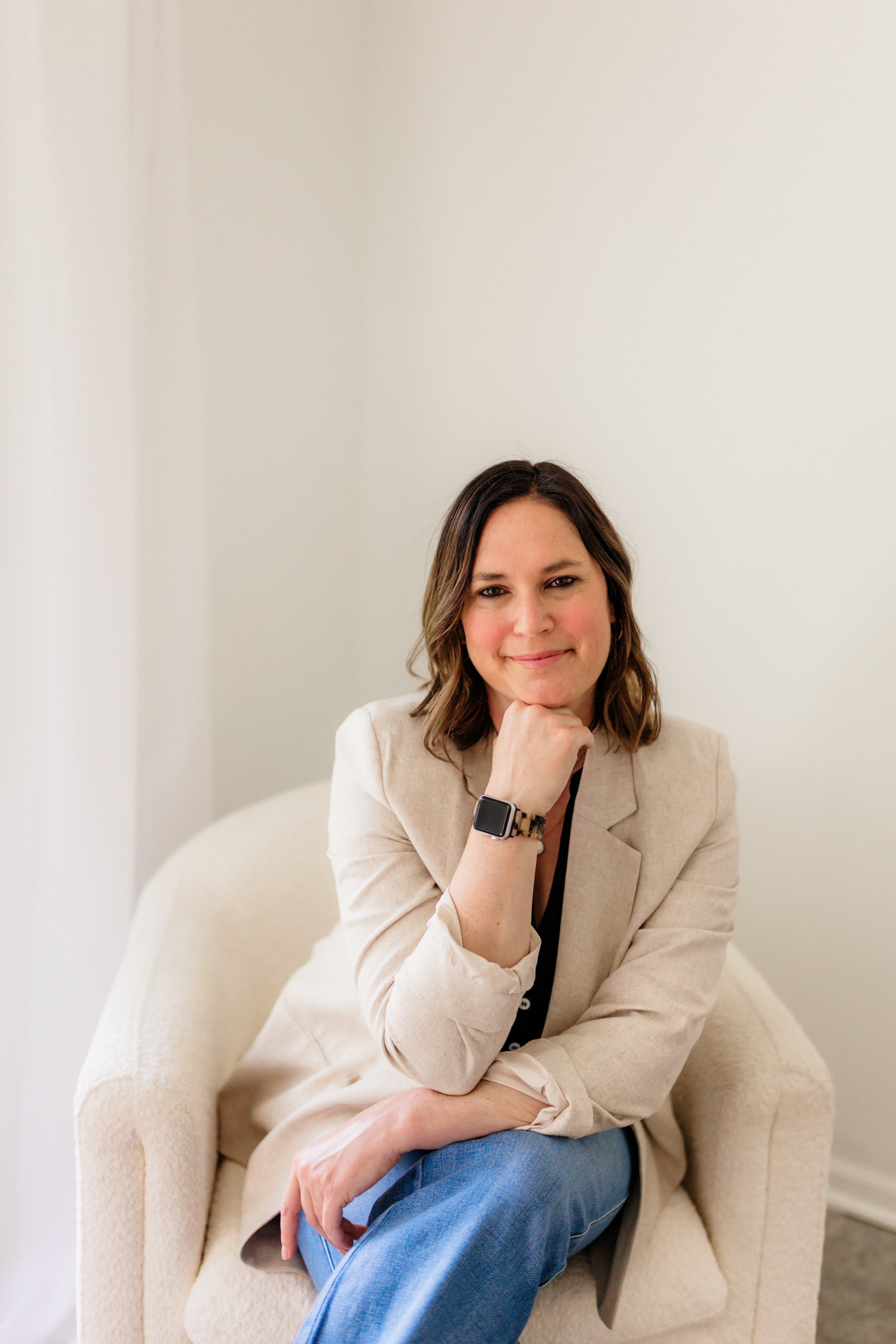 Photo of Jessica Dorzek sitting in a chair and smiling