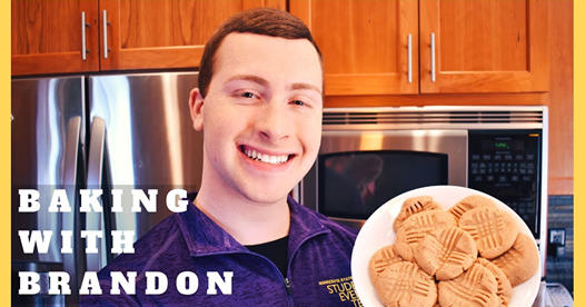 PIcture of BRandon with cookies on a plate