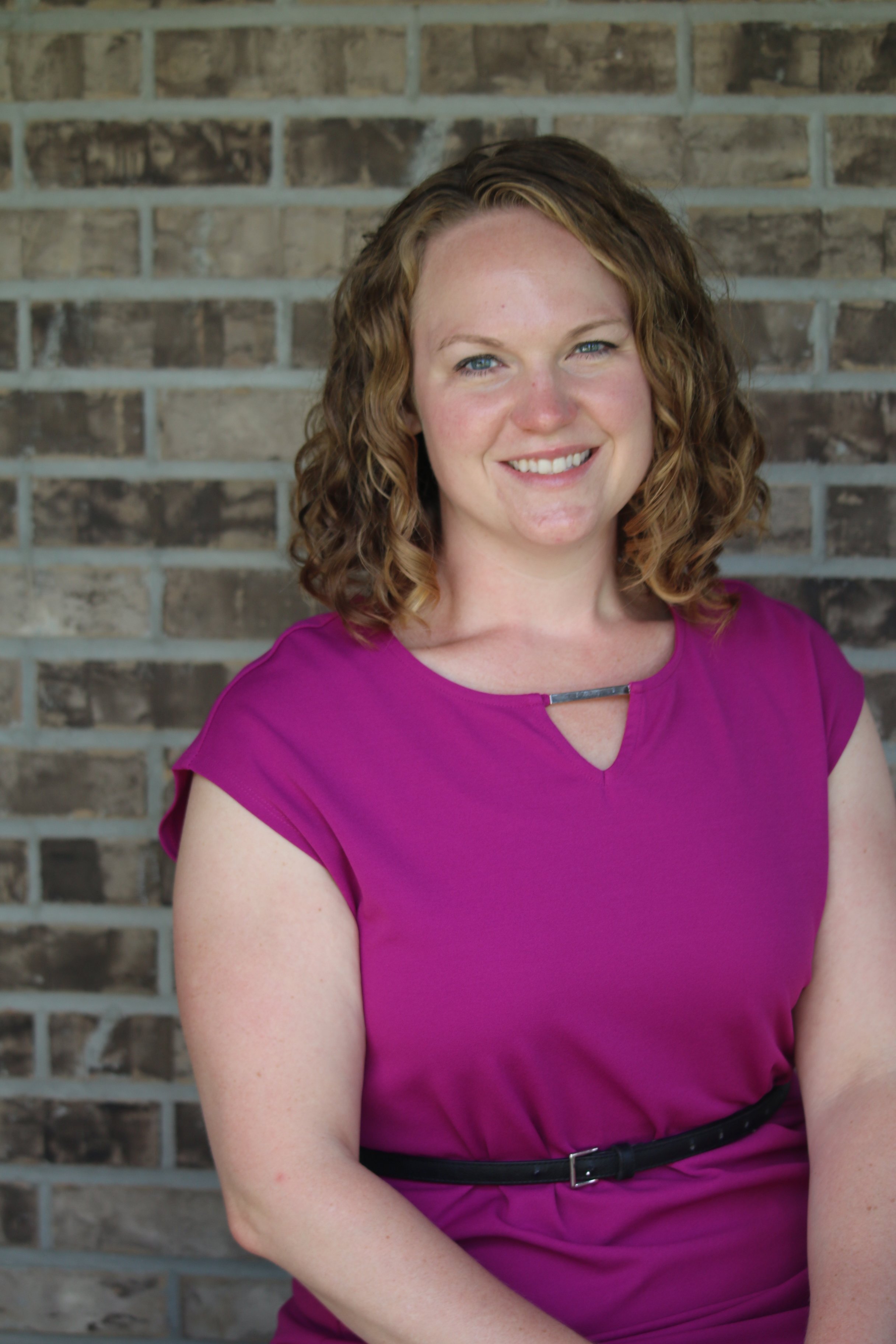 Photo of Erin Gonzalez Sitting and Smiling