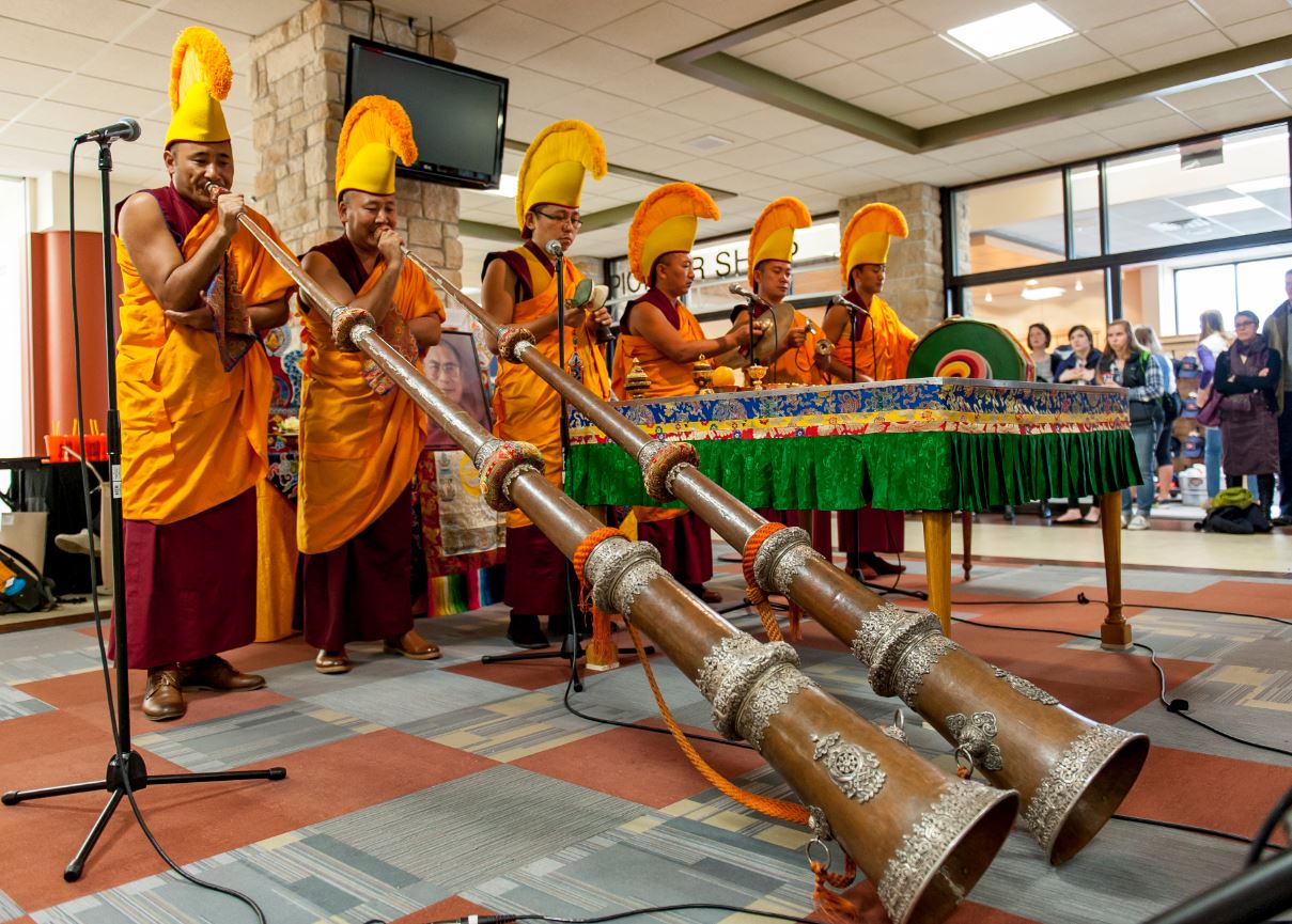 5 Monks blowing horns at opening ceremony