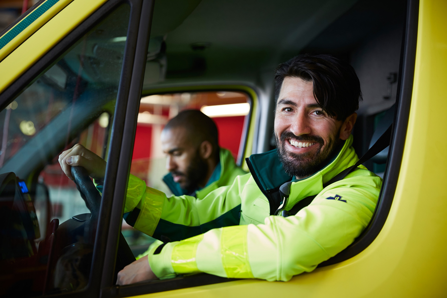 First responder smiling in ambulance