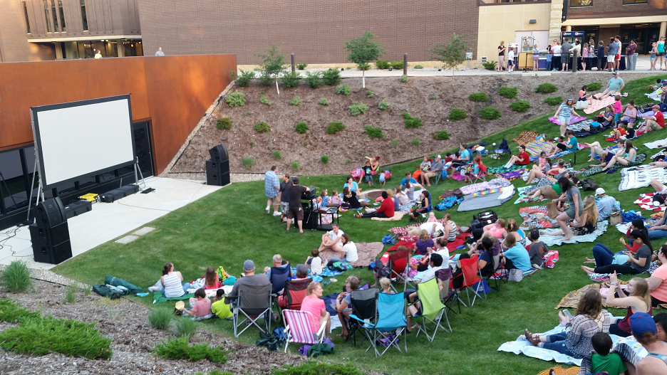 Students at the Outdoor amphitheater movie display for Stomper's Cinema