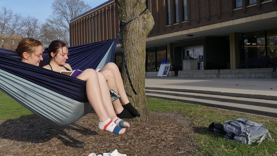 Picture of two students on a hammock near the CSU