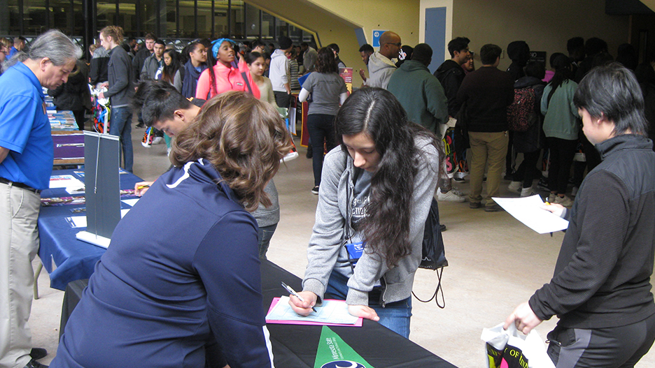 Students in line checking in for Trio Day 