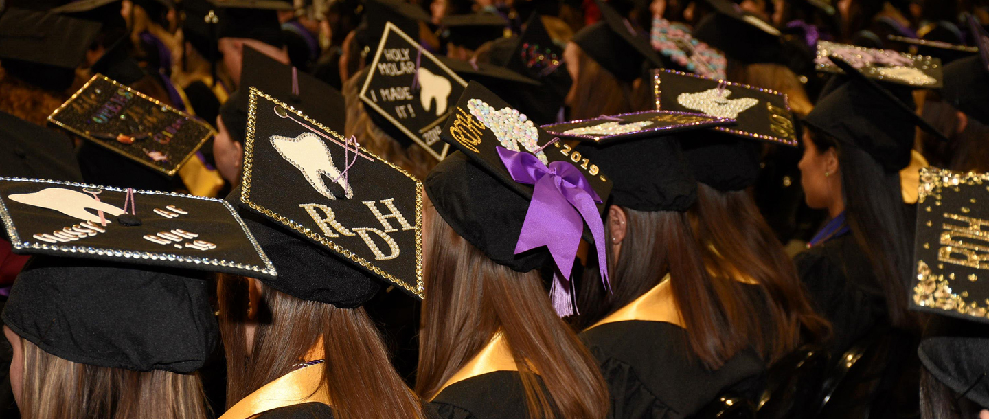 a group of people wearing graduation caps