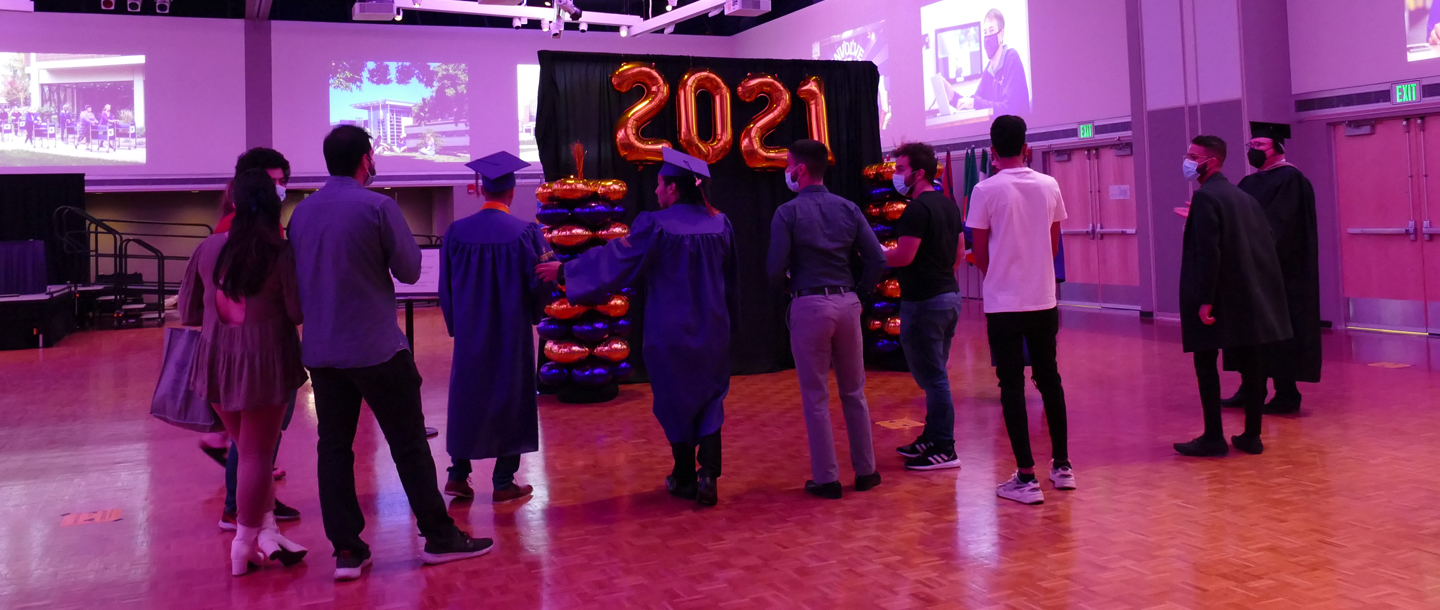 graduates attend graduation walk spring 2021
