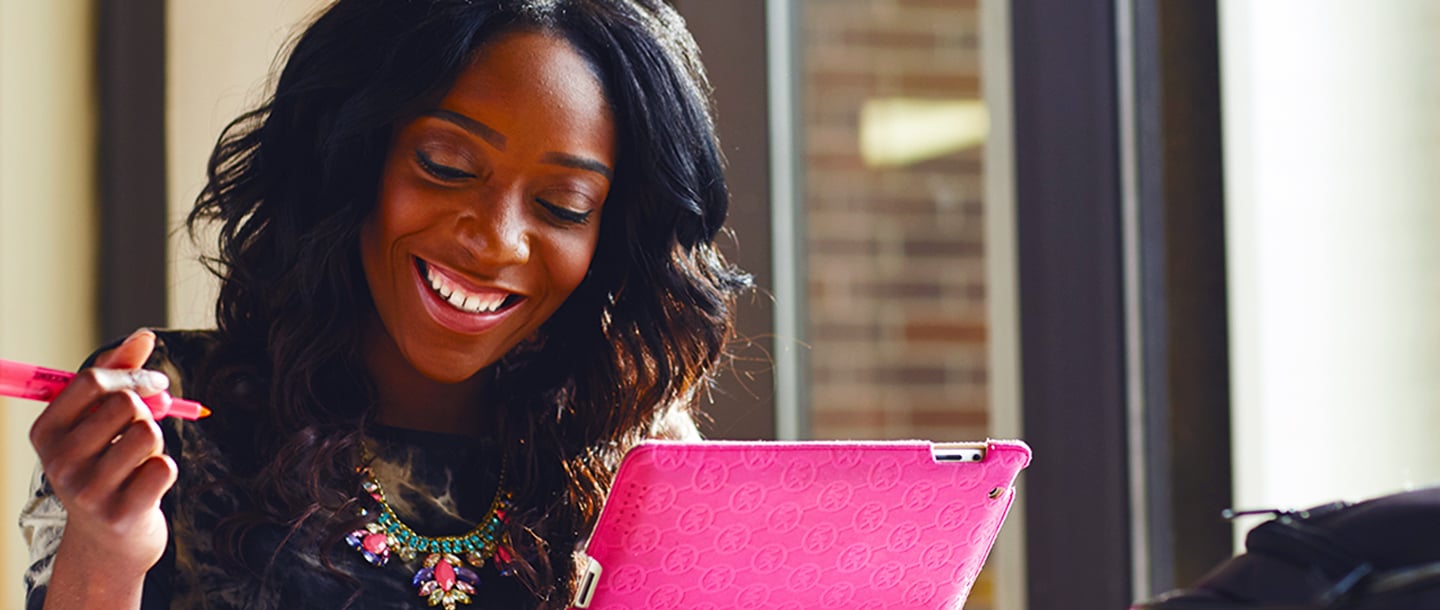Female student studying online with tablet