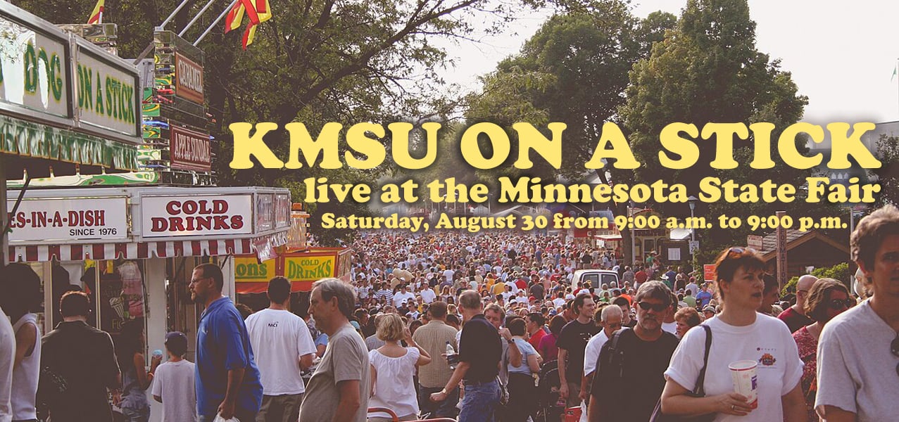 Crowd scene at the Minnesota State Fair with the words KMSU on a stick live at the minnesota state fair saturday august 30 from 9:00 am to 9:00 pm