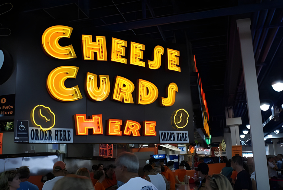 The big neon Cheese Curds sign from the food building at the Minnesota State Fair.