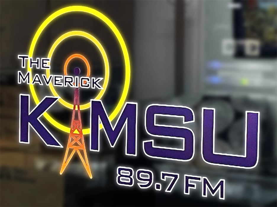 The KMSU logo on a window