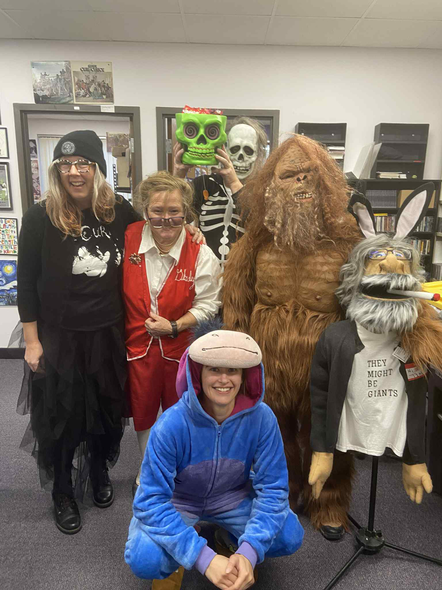 KMSU DJ Jen X (dressed as a goth), Polka Fan Maude Luskey, KMSU DJ Shyboy Tim Lind (dressed as a skeleton), KMSU DJ Katie Jo Findley (dressed as Eeyor), KMSU DJ Shelley Pierce (Dressed as bigfoot), and Hi Boy Tim, the Shyboy Tim puppet.