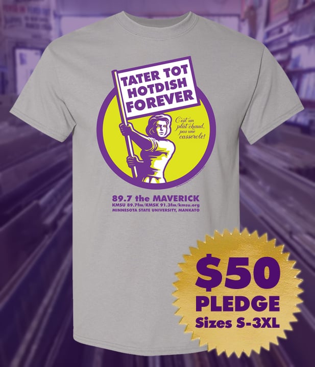 Grey t-shirt with the KMSU tater tot hotdish forever logo, featuring a woman waving a flag that says TATER TOT HOTDISH FOREVER. $50 pledge, sizes small through XXXL