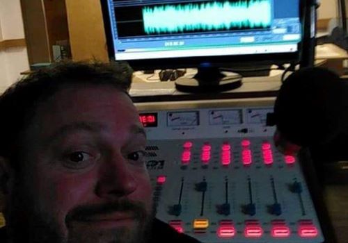 Tom Heffernan in the KMSU radio station doing the Sunday Evening Service show