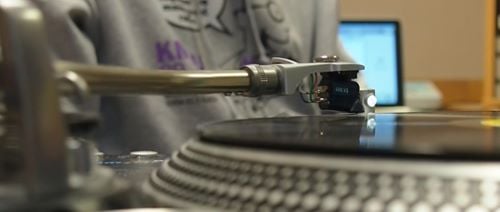 Close up view of DJ and record player in the radio studio