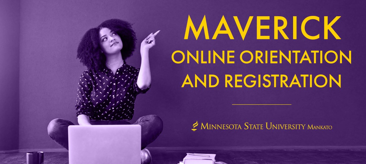 A female student pointing the sign maverick online orientation and registration 