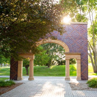 The Minnesota State University Alumni Arch on a sunny evening