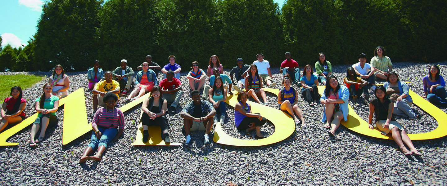 a group of people sitting on rocks
