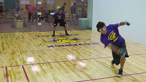 Two male students playing handball