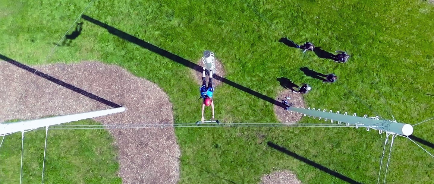 Aerial view of student doing the ropes course