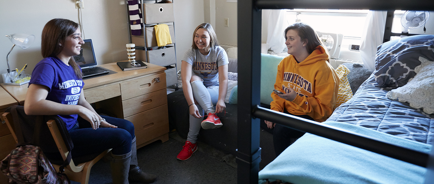 Students chatting in a dorm room
