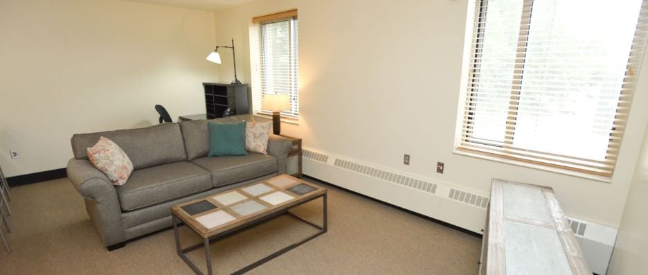 View of living room and study area inside the JS 187 Hall Resident staff apartment
