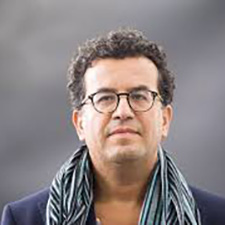a person wearing glasses and a scarf