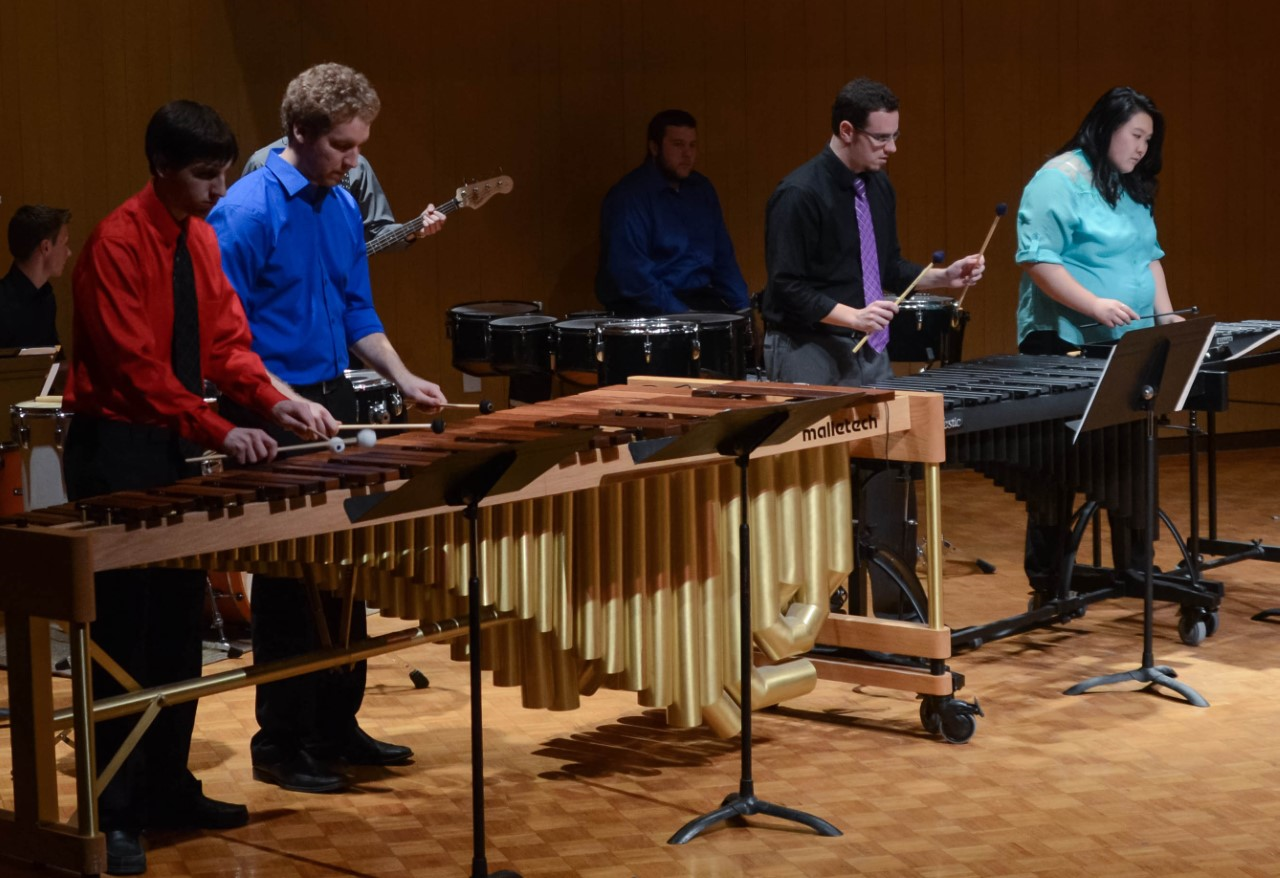 a group of people playing instruments